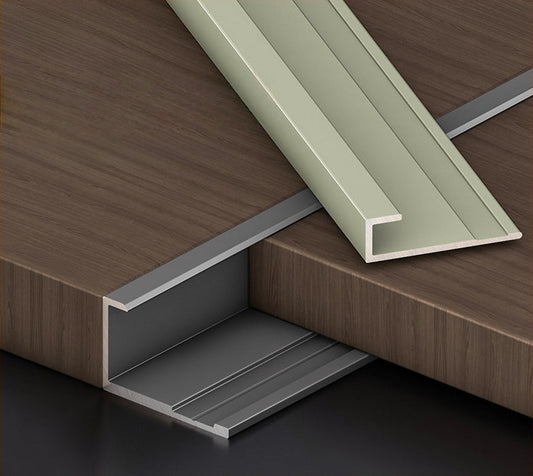 Aluminum wall panel trim channel installed between wood panels, creating a clean recessed joint and modern transition for decorative interior wall panel systems