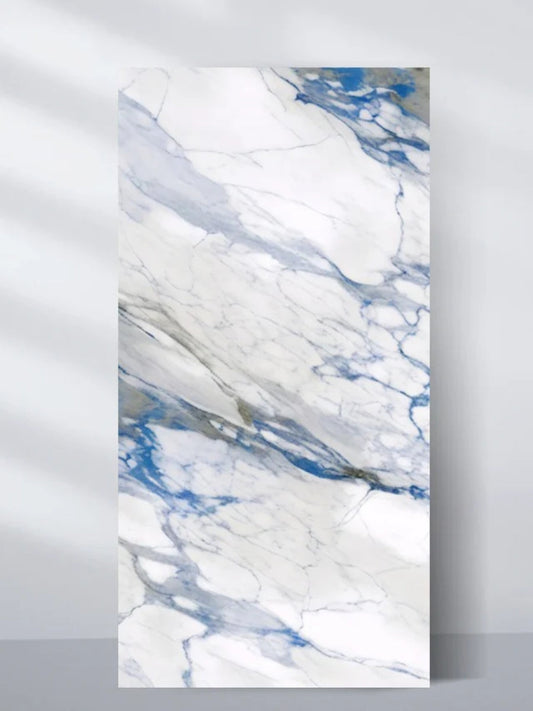 Upright 4 x 8 ft Calacatta Azur PVC wall panel with a white marble look and sweeping blue-gray veining