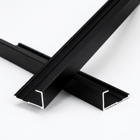 Two crossed black aluminum alloy end cap trim pieces with open channel profiles