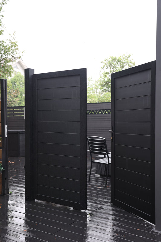 Modern black aluminum privacy double gate with horizontal panels on outdoor deck