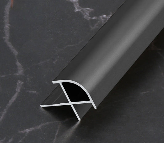 Black aluminum curved edge trim profile for wall panel corners, designed to provide smooth edge protection and a clean modern finish for interior panel installations