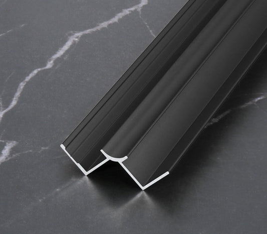 Black aluminum wall panel trim profiles with curved edge design, providing durable edge protection and clean modern transitions for interior wall panel installations
