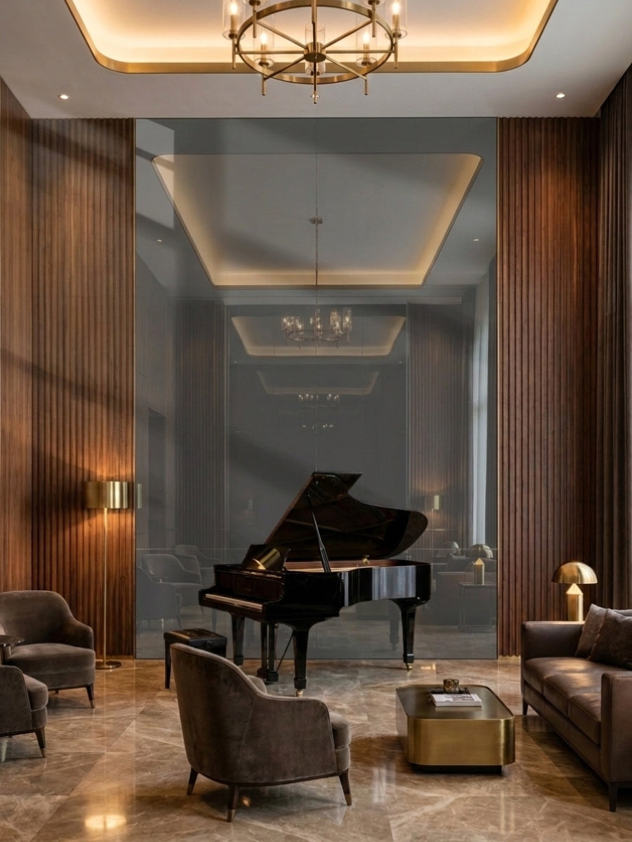 Large gray mirror wood veneer panels forming a reflective feature wall behind a grand piano