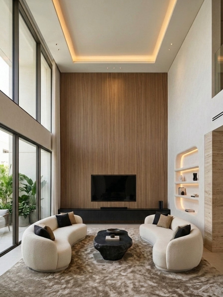 Floor-to-ceiling ash wood veneer wall panels framing a television in a double-height living room