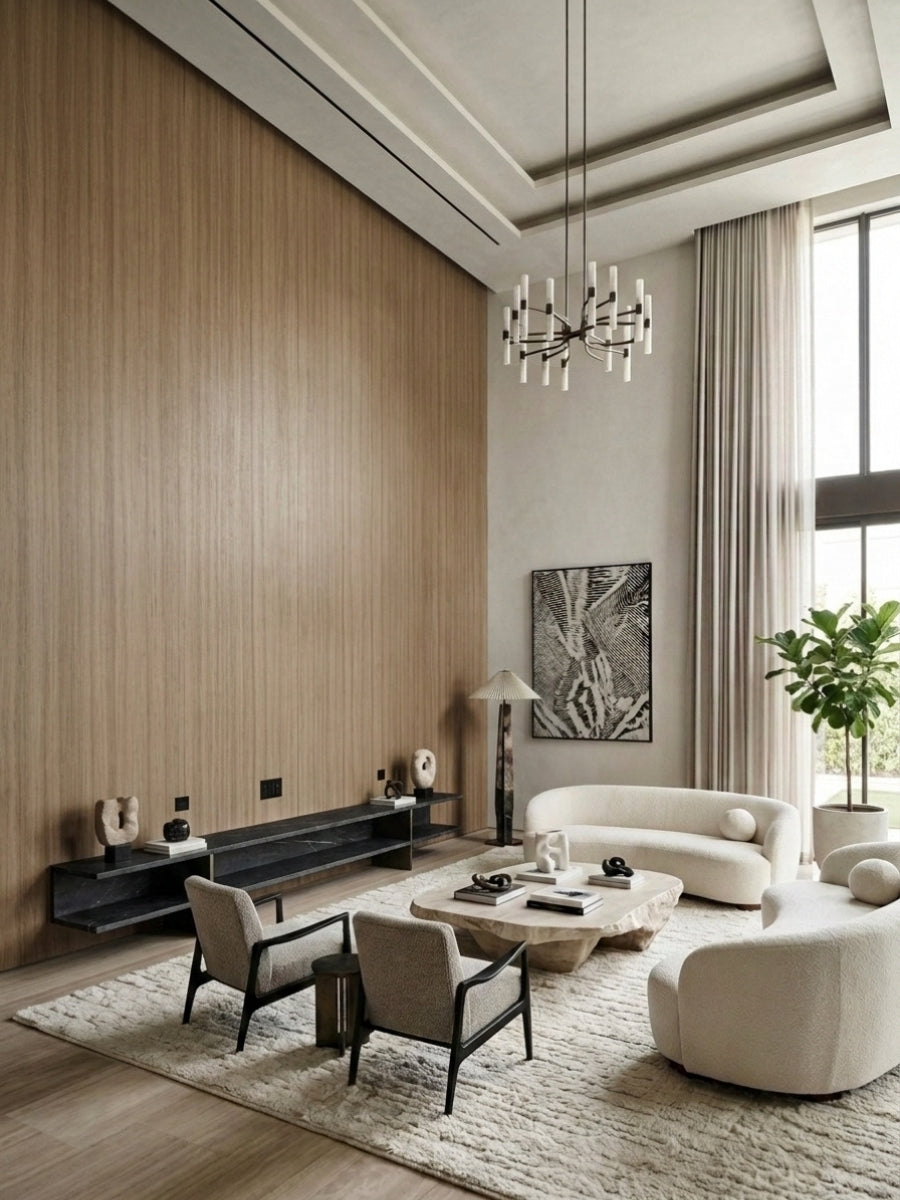 Vertical ash wood veneer panels covering a tall living room feature wall beside large windows