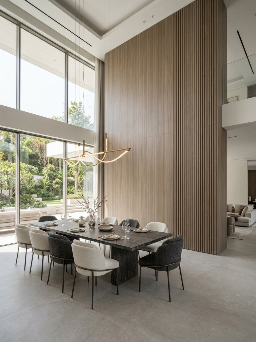 Ash wood veneer wall panels installed as a floor-to-ceiling dining room feature wall with vertical fluted sides