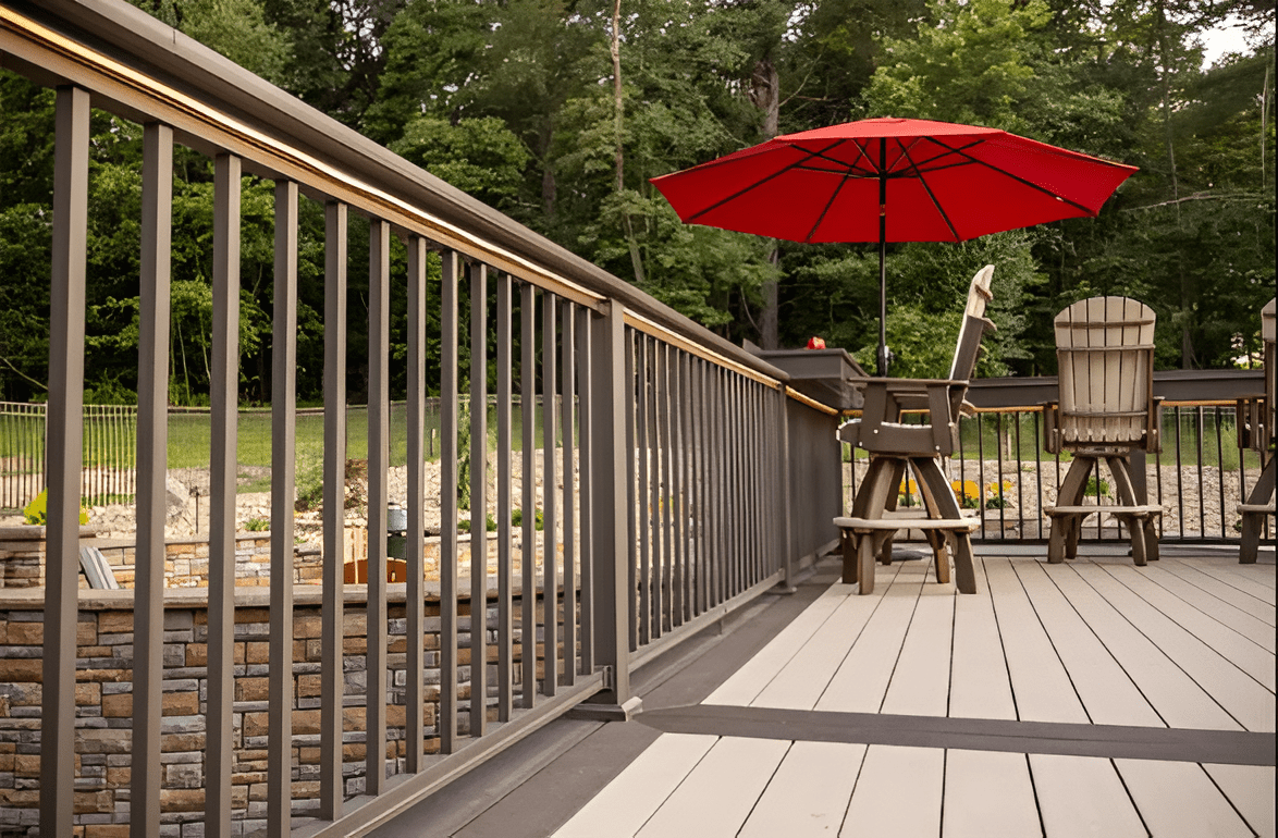 Durable brown composite railing on a low-maintenance deck surrounded by trees in New Jersey