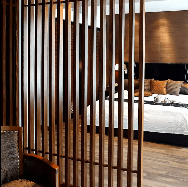 Dark brown WPC timber vertical louvers for bedroom partition