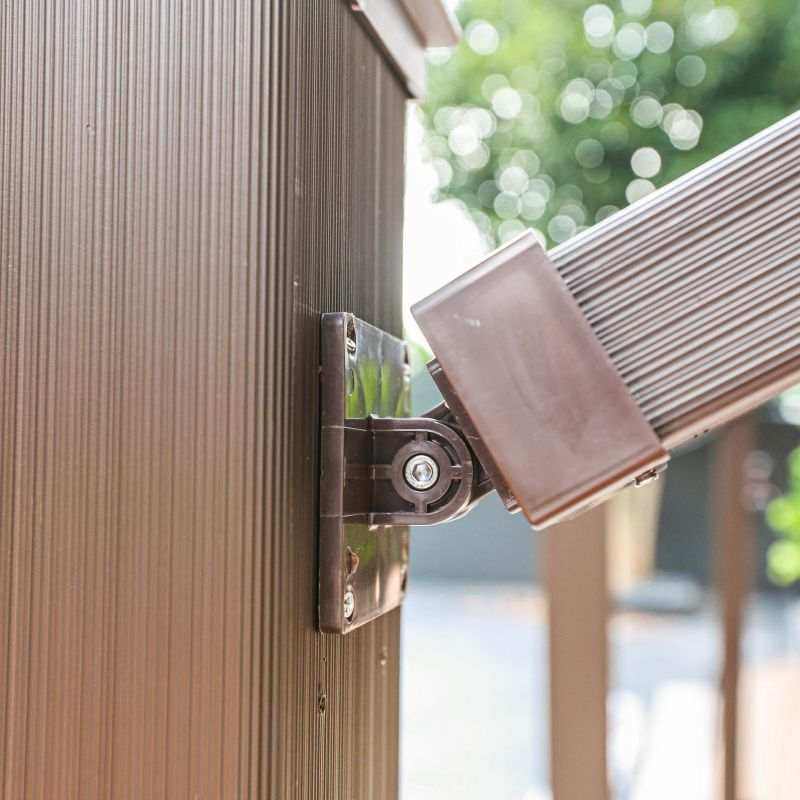 Deck railing connector clip close up Brown composite railing kit with durable low maintenance design