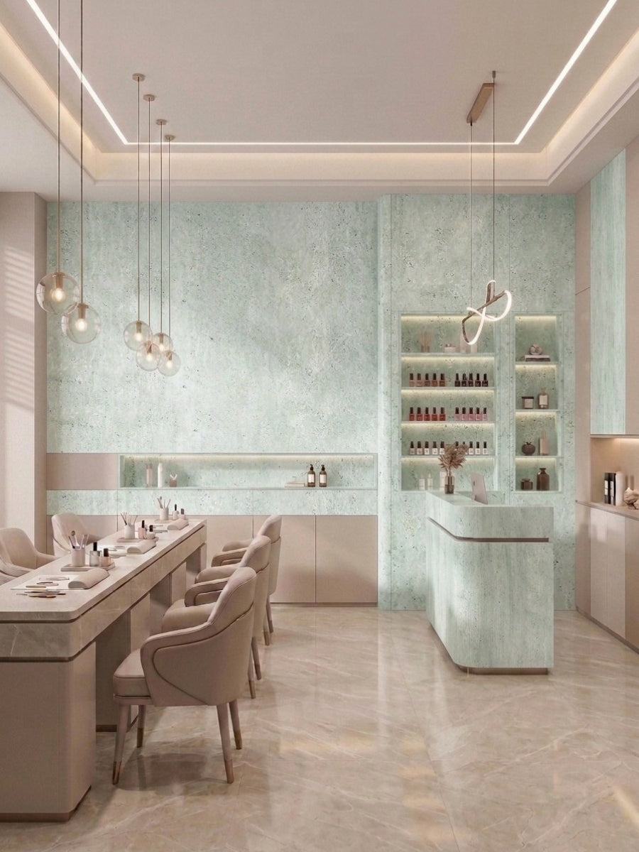 Pale green travertine stone marble PVC wall panels used across a contemporary salon interior and reception desk
