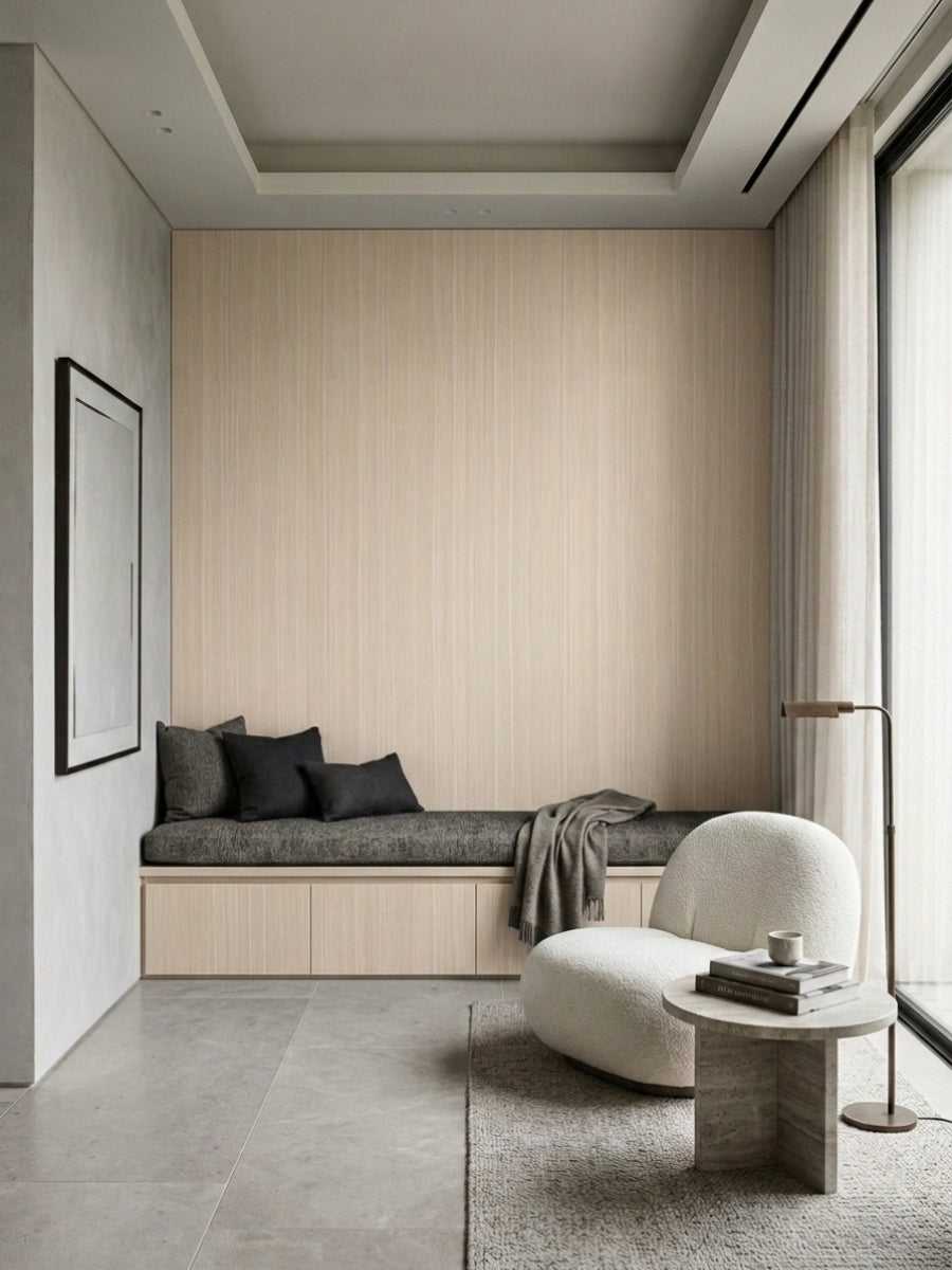 Nordic birch wood veneer panel wall framing a built-in window bench in a minimalist lounge