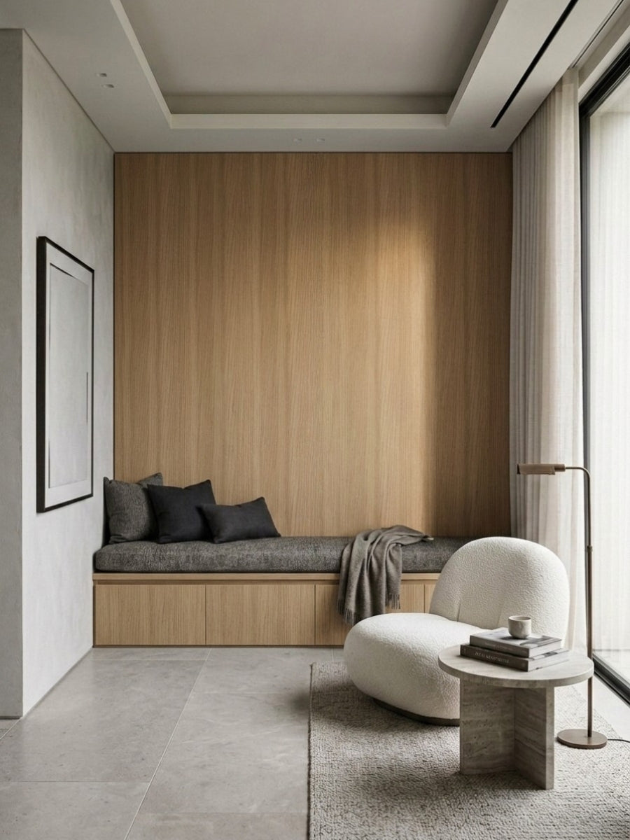 Royal Oak wood veneer feature wall above a built-in window bench in a minimalist sitting area