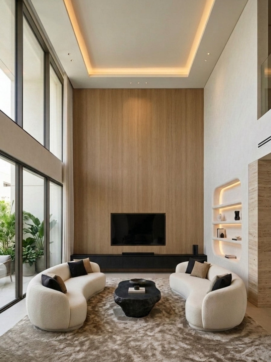 Double-height living room with Royal Oak wood veneer paneling behind a wall-mounted television