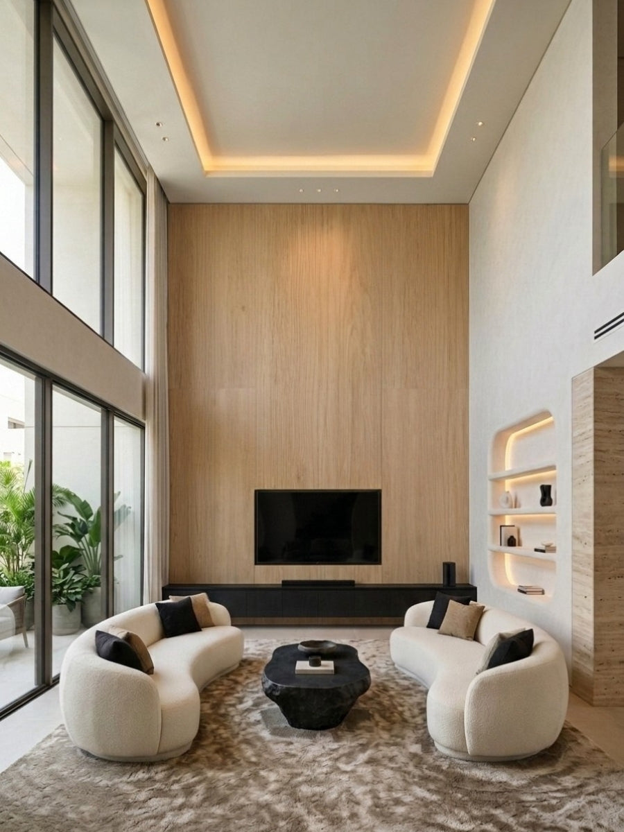Floor-to-ceiling white oak veneer feature wall with mounted TV in a double-height living room