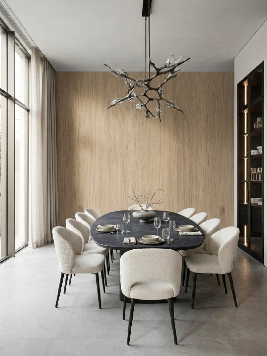 White oak veneer paneled dining room wall behind an oval table and upholstered chairs
