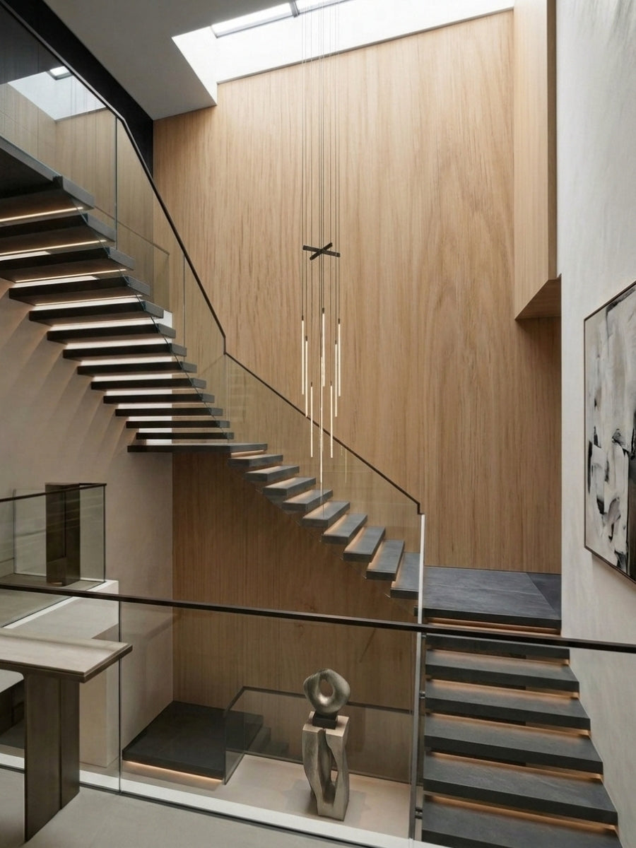 White oak veneer wall panels lining a double-height modern stairwell with floating steps