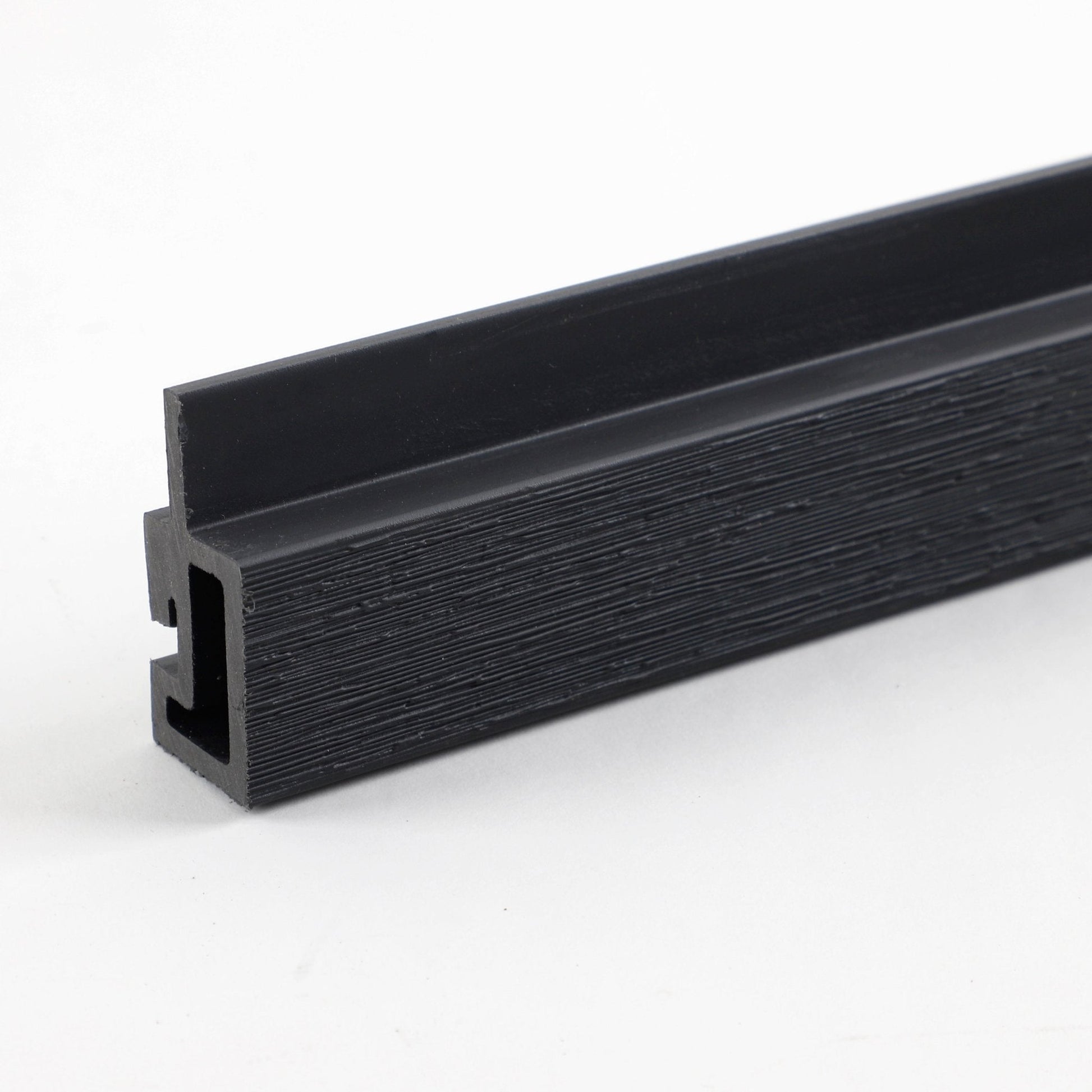 Black composite L trim profile for exterior siding and wall panel edges