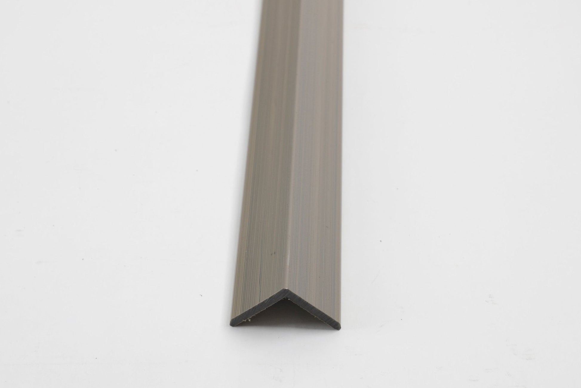 Bronze aluminum corner trim for exterior wall panels and cladding edges