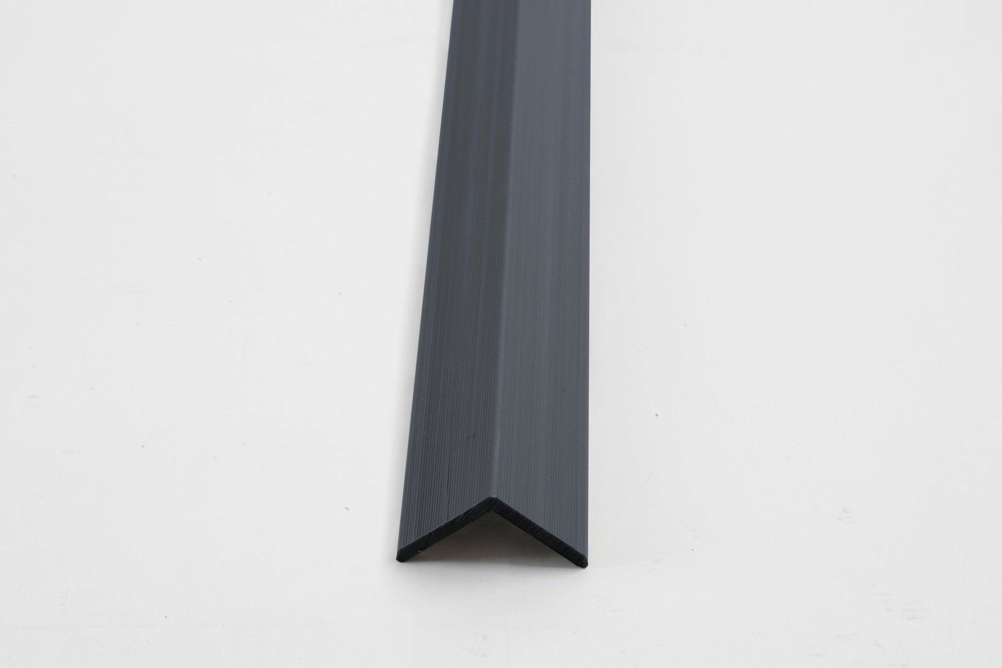 Dark gray aluminum corner trim for exterior wall panels and cladding edges